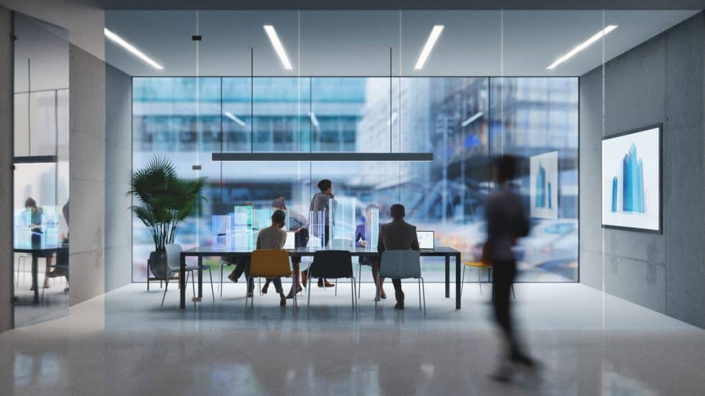 Group of people working in a modern AEC firm boardroom with augmented reality interface.